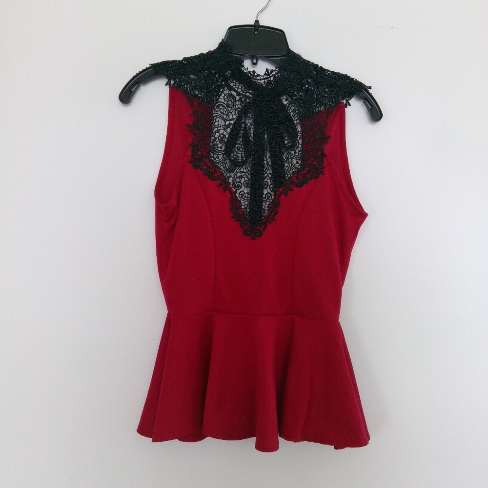 Red peplum sleeveless top. Black lace. Tie back